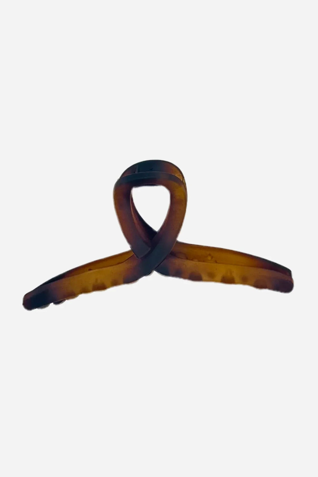 Hårspænde i brun havana med tortoiseshell effekt og snoet design.