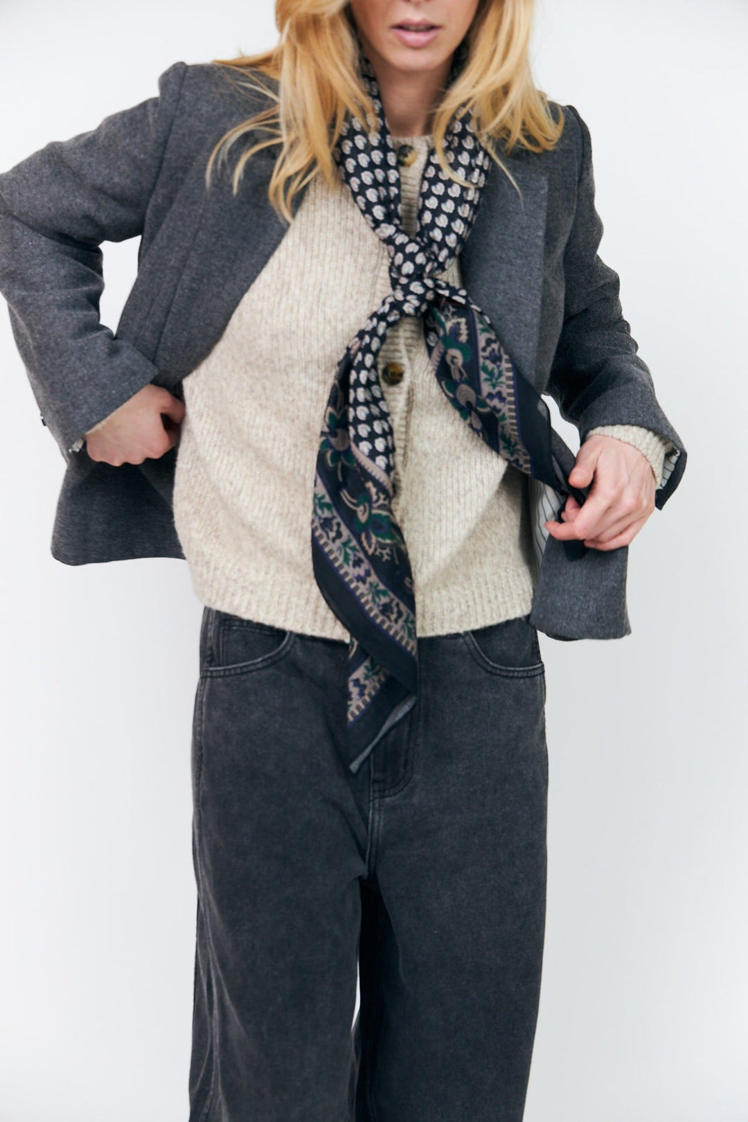 Lollys Laundry JennaLL Big Scarf in black, made of 100% cotton, styled on a model wearing casual attire.