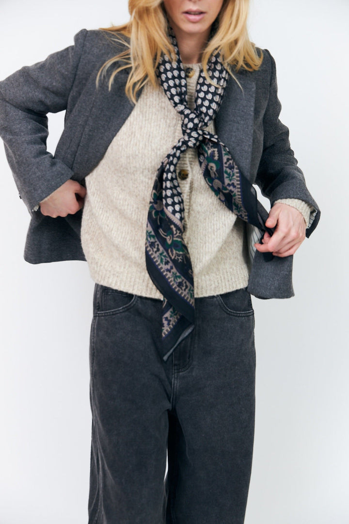 Lollys Laundry JennaLL Big Scarf in black, made of 100% cotton, styled on a model wearing casual attire.