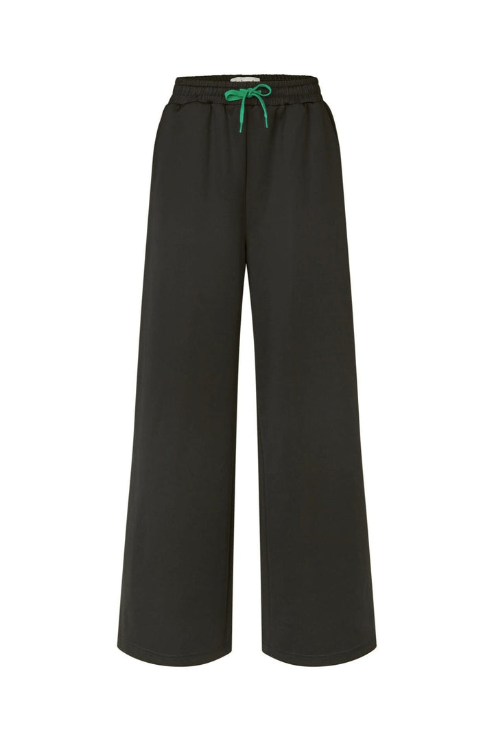 Lollys Laundry LiamLL Pants in black, featuring a wide-leg design and green drawstring, made of polyester and elastane, shown