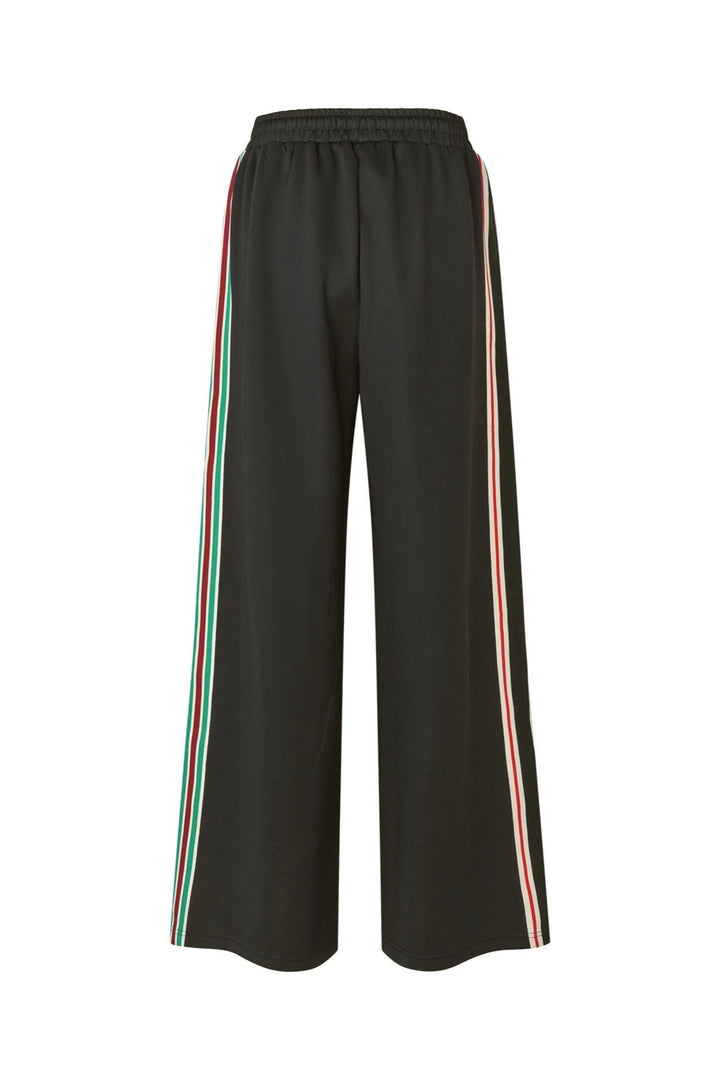 Lollys Laundry LiamLL Pants in black with colorful side stripes, made of polyester and elastane, shown flat front view.