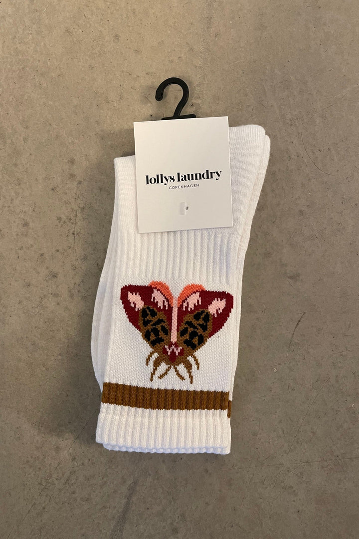 Lollys Laundry RowanLL Socks in 54 Rust color, featuring a butterfly design, displayed flat with a branded tag.