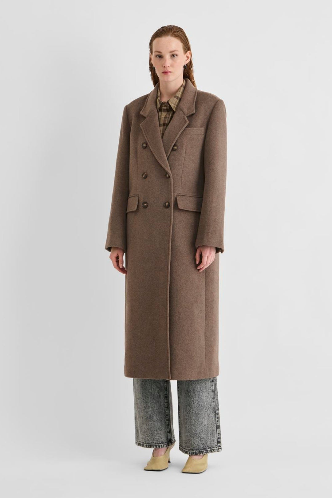 Vila Rouriley long sleeve coat in dark brown, made of 50% recycled wool and 50% polyester, shown on a model.