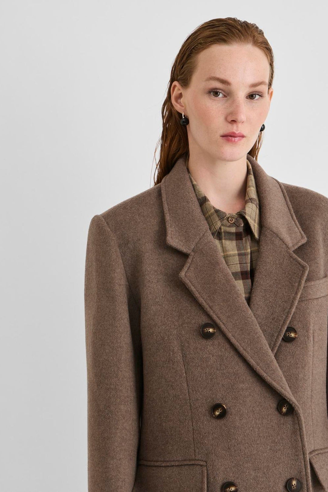 Vila Rouriley long sleeve coat in dark brown mélange wool blend, featuring a double-breasted button closure, worn by a model.
