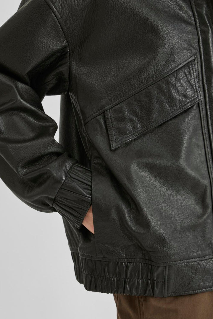 Vila ROUSIMONE oversized leather jacket in meteorite color, detailed close-up showing texture and pocket design.